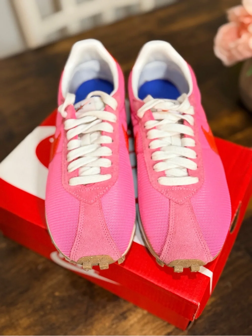 Nike Women's Pink Sneakers with Orange Swoosh